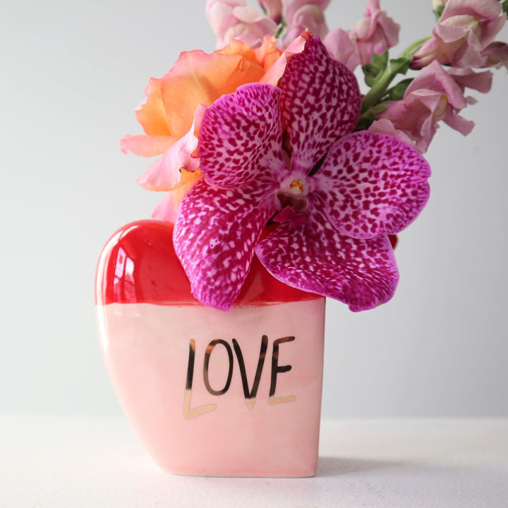 Vanda orchid in a love bud vase. Stacy K Floral Valentines day collections. Valentines Day delivery Rochester NY