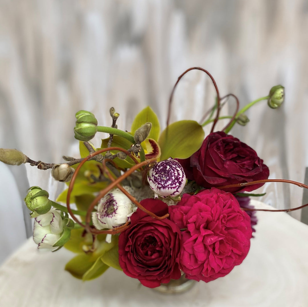 spring arrangement with ranunculus and garden roses